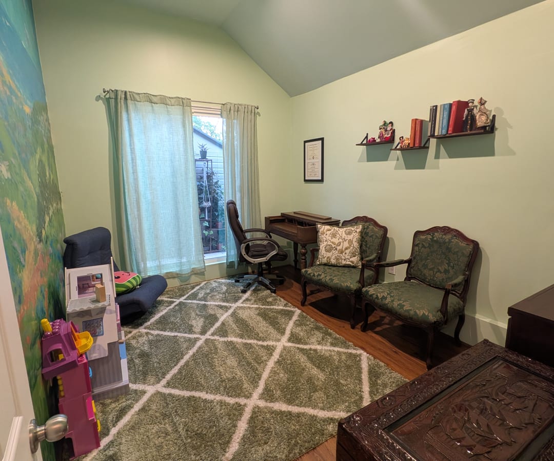 The waiting area at Dr. Levi's office with soft seating and warm light